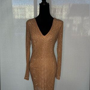Turn heads in this stunning, rhinestone-studded dress!